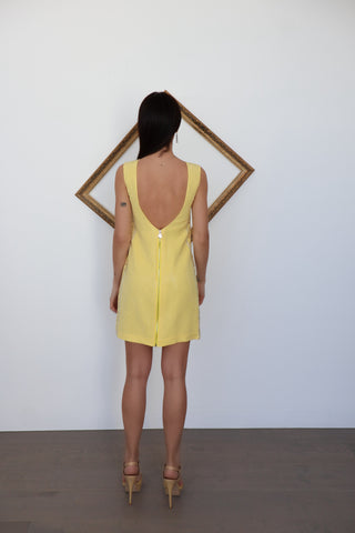 Versace x H&M yellow studded sleeveless mini dress with scoop back, photographed on model for Luxury Kulture.