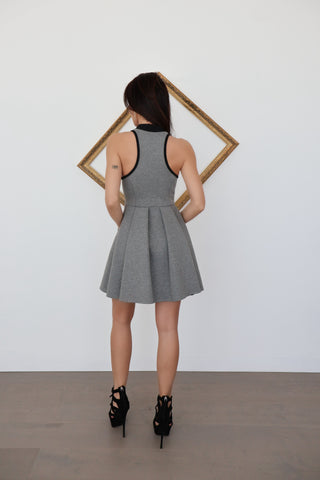 Alexander Wang grey sleeveless flared mini dress with racerback and front zip, photographed on model for Luxury Kulture.