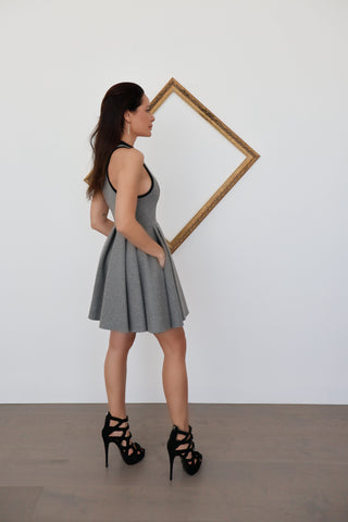 Alexander Wang grey sleeveless flared mini dress with racerback and front zip, photographed on model for Luxury Kulture.