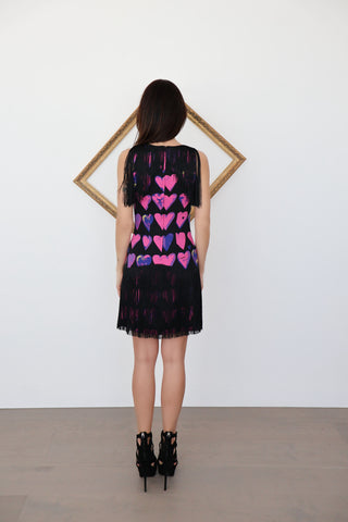 Versace x H&M sleeveless heart-print mini dress with black fringe, photographed on model for Luxury Kulture.