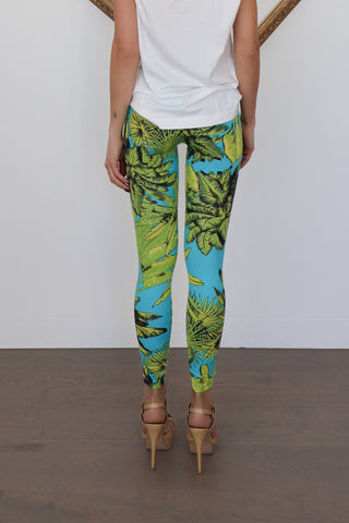 Versace x H&M blue tropical-print leggings photographed on model for Luxury Kulture.