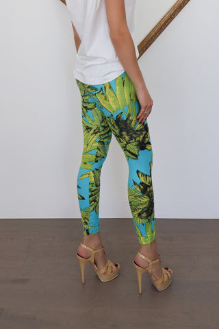 Versace x H&M blue tropical-print leggings photographed on model for Luxury Kulture.