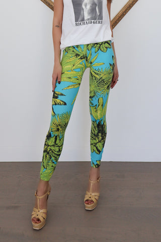 Versace x H&M blue tropical-print leggings photographed on model for Luxury Kulture.