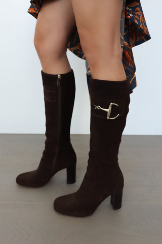 Gucci brown suede knee-high boots with gold horsebit detail photographed for Luxury Kulture.
