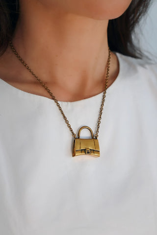 Balenciaga gold bag necklace with miniature handbag charm