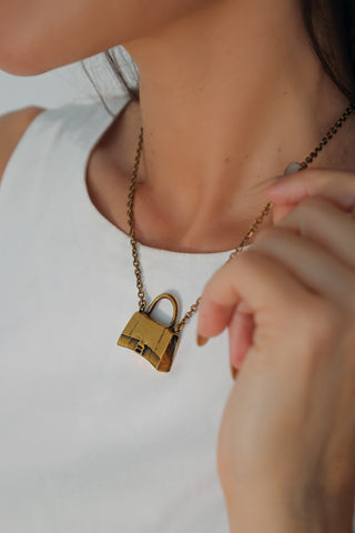 Balenciaga gold bag necklace with miniature handbag charm