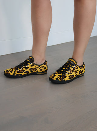 Dolce and Gabbana yellow leopard print calf hair low top sneakers with lace-up design and rubber sole