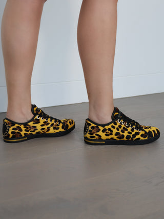 Dolce and Gabbana yellow leopard print calf hair low top sneakers with lace-up design and rubber sole