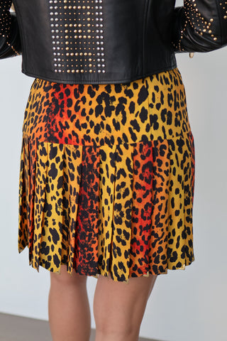 Versace x H&M 2011 leopard print silk mini skirt with central pink sunset graphic and baroque detailing