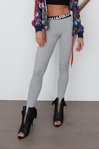 Dsquared2 grey cotton leggings with black logo waistband, fitted silhouette, photographed on model
