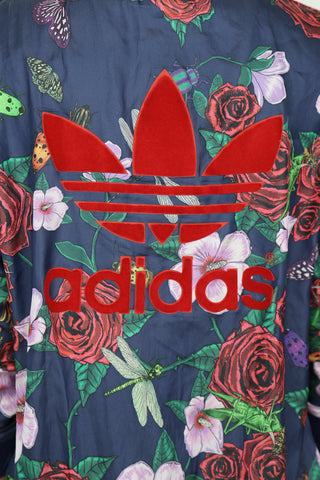 Adidas Originals x Rita Ora navy blue track jacket with floral and insect print and zip front
