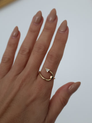 Burberry gold hook pavé ring with clear crystal detailing displayed with original box and dust bag