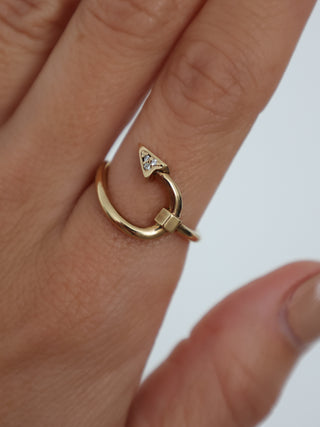 Burberry gold hook pavé ring with clear crystal detailing displayed with original box and dust bag