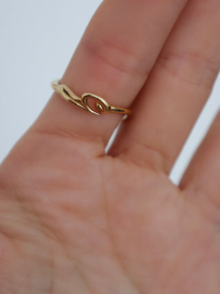 Burberry gold hook pavé ring with clear crystal detailing displayed with original box and dust bag