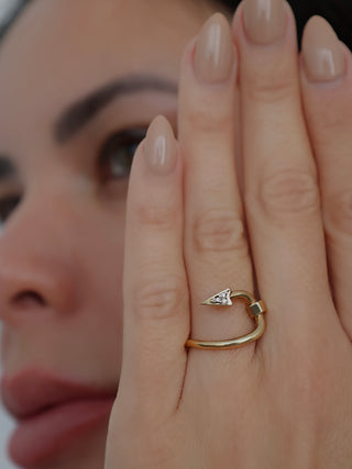 Burberry gold hook pavé ring with clear crystal detailing displayed with original box and dust bag