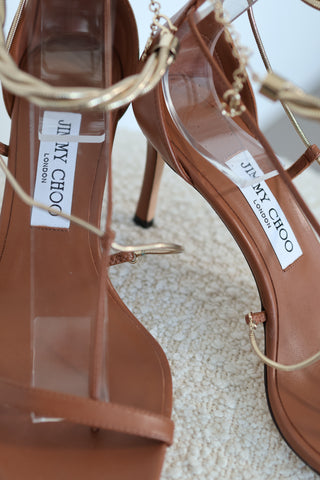 Jimmy Choo Oriana 75 camel leather heels with gold chain ankle straps and square toe design, size EU 38.5.