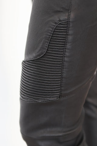 Balmain x H&M black quilted leather biker pants, slim-fit silhouette, size EU 34.