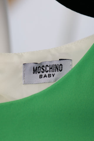 Moschino Kids green and white dress with teddy bear and balloon graphic, size 3 years.