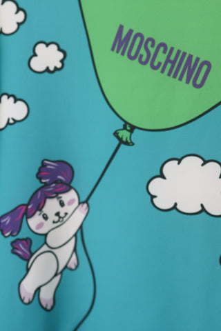 Moschino Kids green and white dress with teddy bear and balloon graphic, size 3 years.