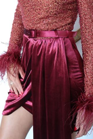 Lavish Alice Amira red mini dress with sequin embellishments, feather-trim detailing, stretch fabric, and fitted silhouette.