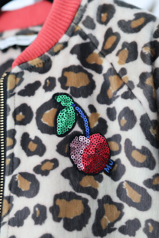 Marc Jacobs girls leopard faux fur jacket with sequin cherry patch, zip-front design, photographed in detail.