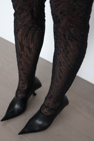 Mugler x H&M black sheer mesh tights with all-over rhinestone embellishment in a signature starburst pattern, new with tags.