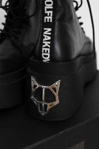 Naked Wolfe Saturn black leather platform lace-up ankle boots in Size 8 featuring a 160mm platform sole, metallic Wolfe head heel detail and signature NAKED WOLFE branding, displayed with the original box and tags.
