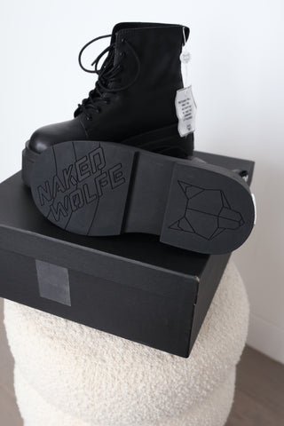 Naked Wolfe Saturn black leather platform lace-up ankle boots in Size 8 featuring a 160mm platform sole, metallic Wolfe head heel detail and signature NAKED WOLFE branding, displayed with the original box and tags.