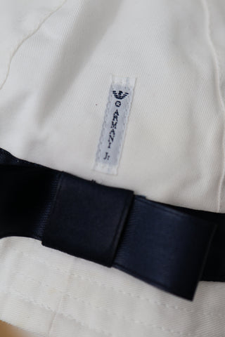 Armani Junior white cotton hat with navy eagle logo, size II.