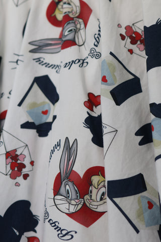 Monnalisa white cotton dress with Bugs Bunny and Lola Bunny print, size 6 years.