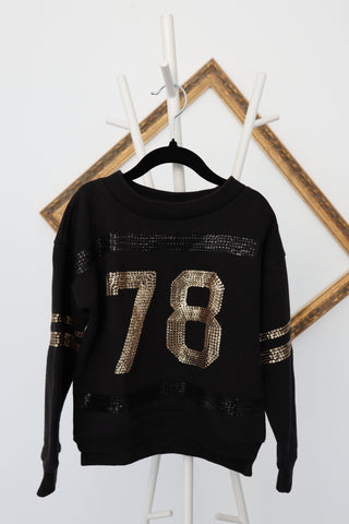 Diesel Kids black long-sleeve pullover with gold sequin stripes and ‘78’ front graphic, size 7 years