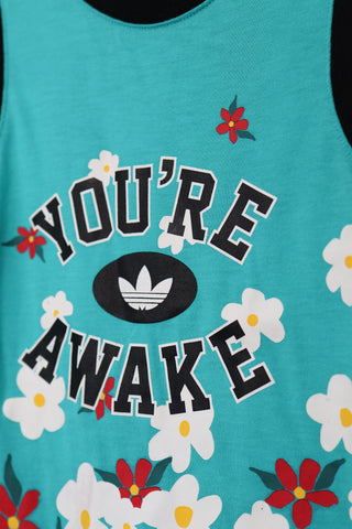 Adidas Originals x Pharrell Williams turquoise “You’re Awake” daisy tank top, size 3–4 years.