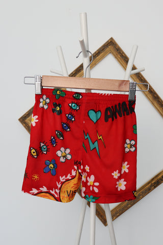 Adidas Originals x Pharrell Williams red floral and graffiti doodle print shorts, size 3–4 years.