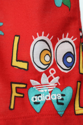 Adidas Originals x Pharrell Williams red floral and graffiti doodle print shorts, size 3–4 years.
