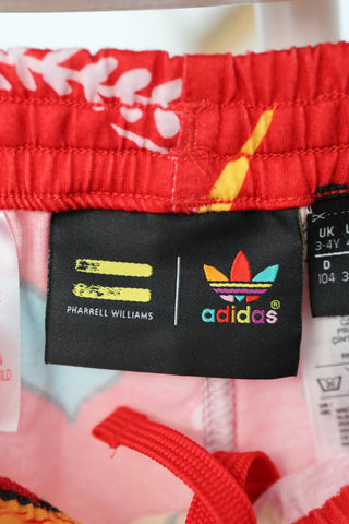 Adidas Originals x Pharrell Williams red floral and graffiti doodle print shorts, size 3–4 years.