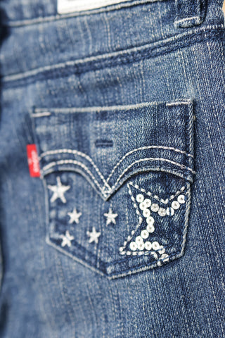 Levi’s girls blue flare jeans with sparkly star embroidery on front and back pockets, size 4.