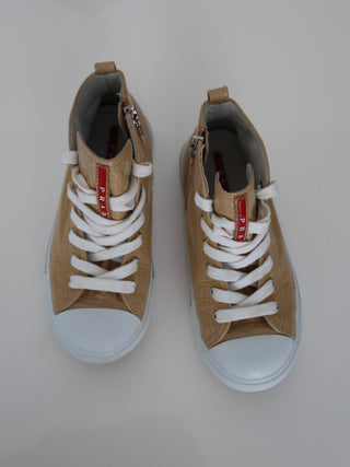 Prada toddler beige patent leather high-top sneakers with lace-up and side zip closure.