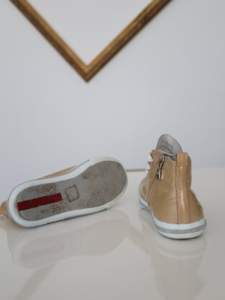 Prada toddler beige patent leather high-top sneakers with lace-up and side zip closure.