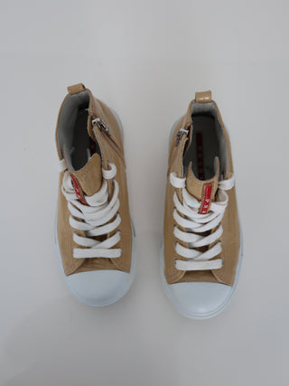 Prada toddler beige patent leather high-top sneakers with lace-up and side zip closure.