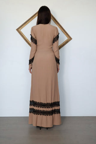 For Love & Lemons nude full-length dress with a plunging V-neckline, long sleeves and contrasting black eyelash lace detailing throughout.