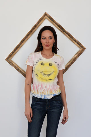 John Galliano neon smiley baby tee with pink logo back print, photographed on model for Luxury Kulture.
