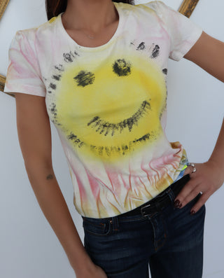 John Galliano neon smiley baby tee with pink logo back print, photographed on model for Luxury Kulture.
