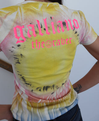 John Galliano neon smiley baby tee with pink logo back print, photographed on model for Luxury Kulture.