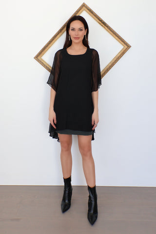 Theyskens’ Theory black chiffon cape mini dress with layered design, sheer sleeves, and flowing back, photographed on model for Luxury Kulture.