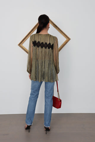 Model wearing a sheer green and gold pleated Zimmermann blouse with black lace detailing, shown from front, back, side and close-up views to highlight the fabric texture and lace panel.