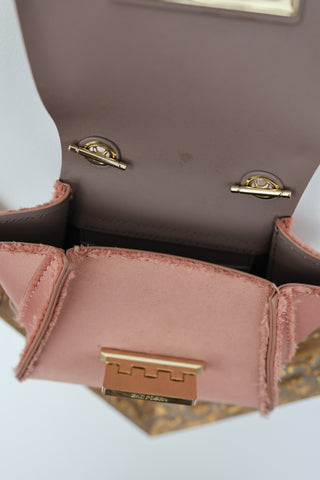 Zac Posen rose pink mini structured handbag with gold chain strap and clasp closure.