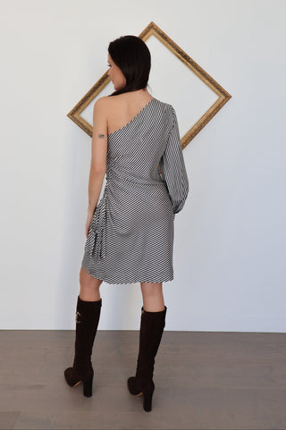 Back view of Zimmermann striped mini dress showing the asymmetric line and soft draping across the back.