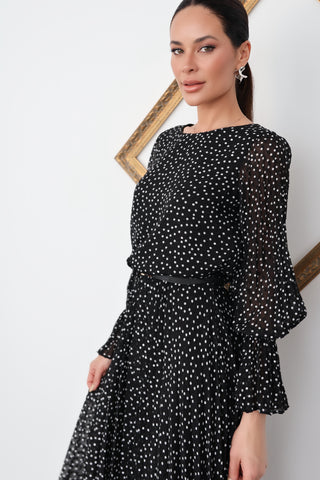Model wearing a black Emporio Armani long dress with white polka dots, featuring a bateau neckline, long sleeves and pleated skirt, shown from multiple angles.