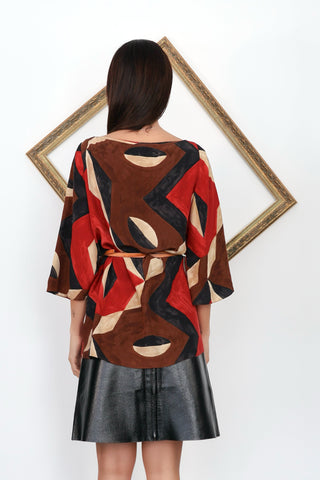 Ralph Lauren silk geometric print blouse with waist belt detail and relaxed fit silhouette.