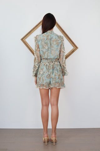 Zimmermann blue paisley floral silk playsuit with ruffle details lace trim and waist tie.
